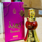 Perfume bottle and packaging with 'Basimah' branding on a neutral background