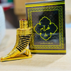 Gold foot-shaped object with a black box featuring Arabic text in the background