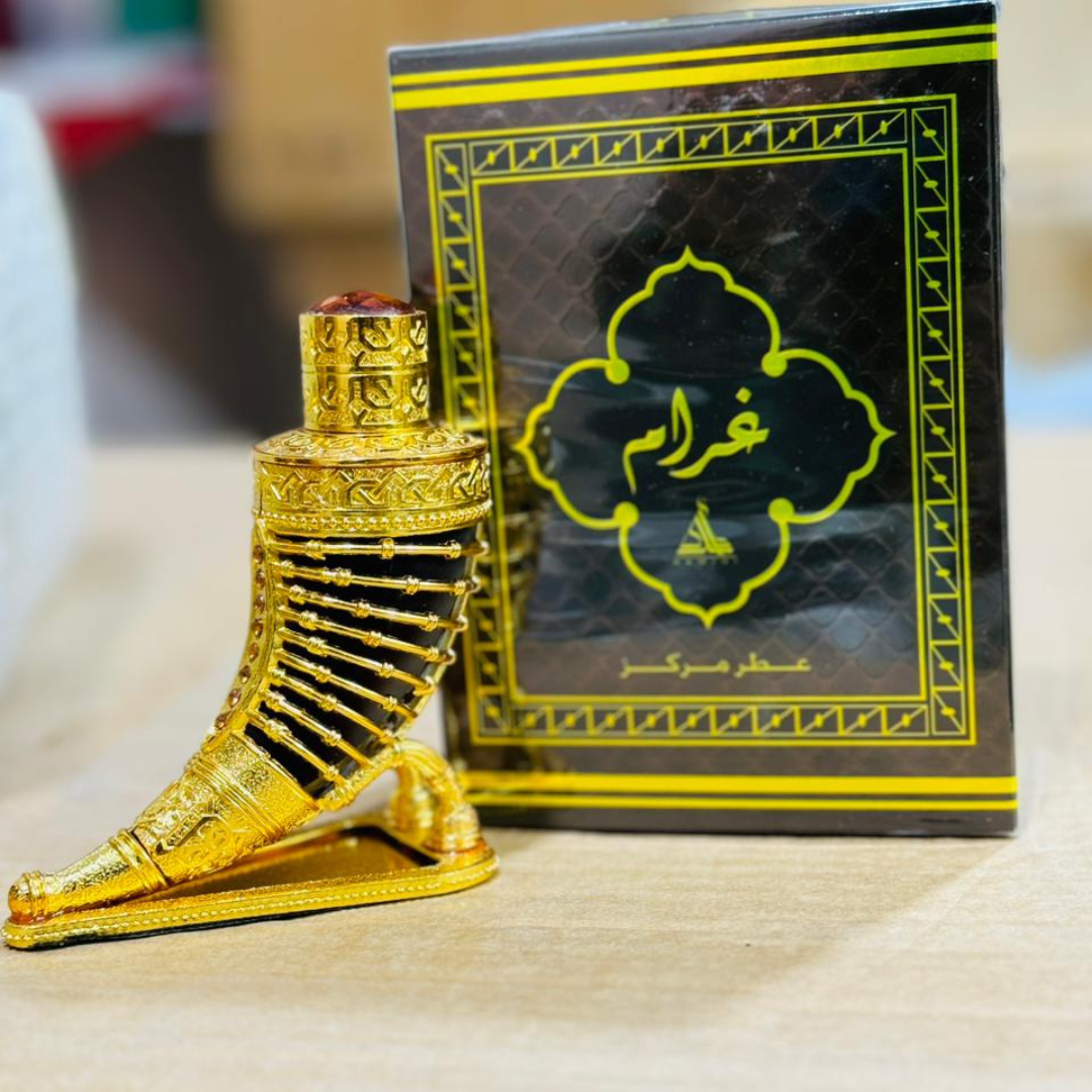 Gold foot-shaped object with a black box featuring Arabic text in the background