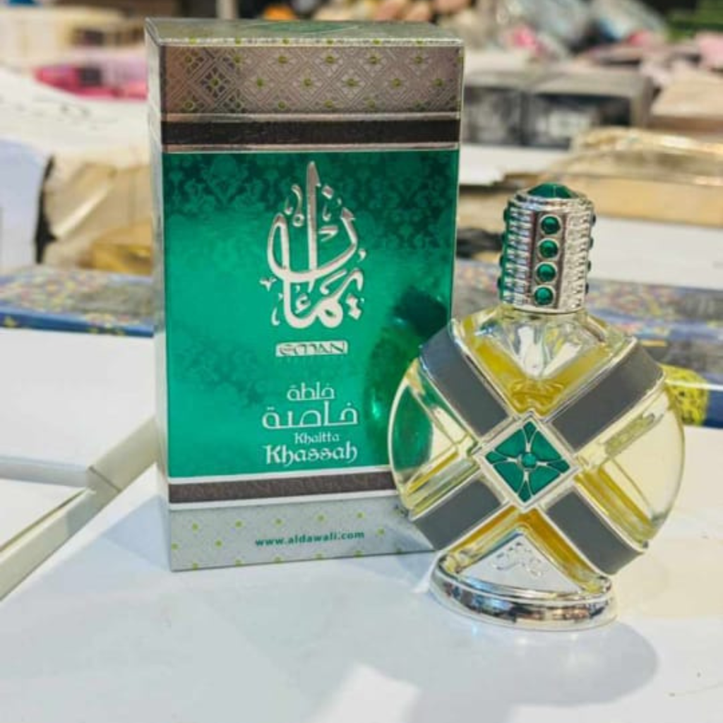 Perfume bottle and packaging with 'Khasah' branding on a blurred background