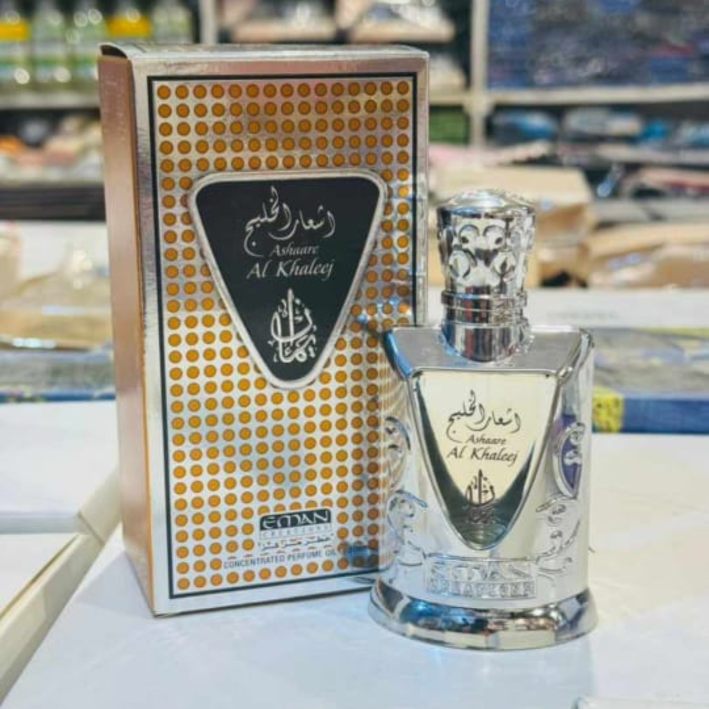 Perfume bottle and packaging of Ashwaq Al Khaleej on a table.