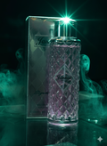 Perfume bottle and packaging with 'Jannat' branding on a dark background with green smoke effects.