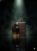 Bottle and box of Gucci Bloom on a dark background with smoke effect