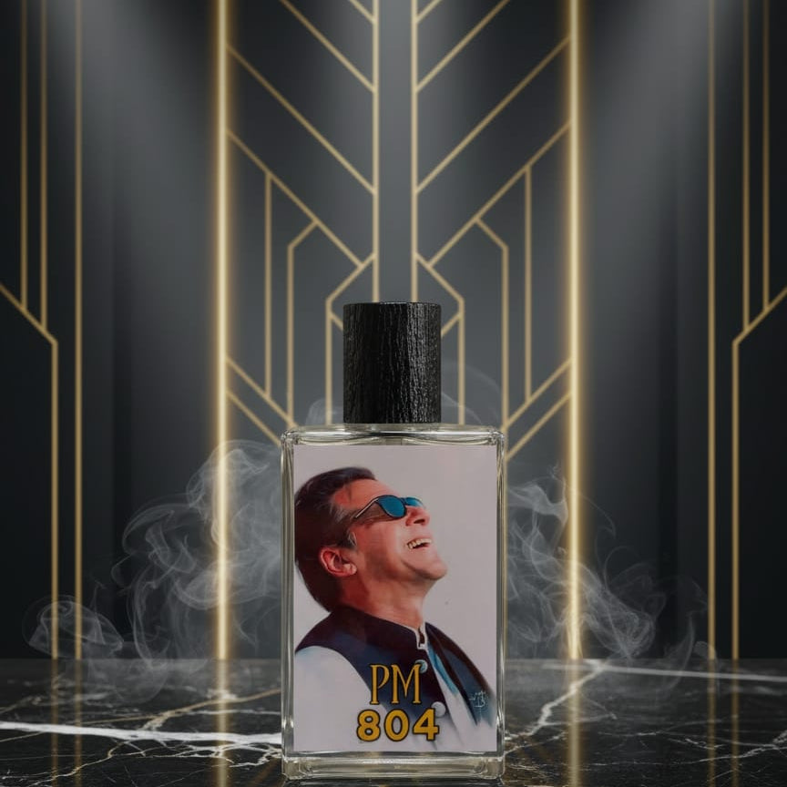 Perfume bottle labeled 'PM 804' with a decorative background