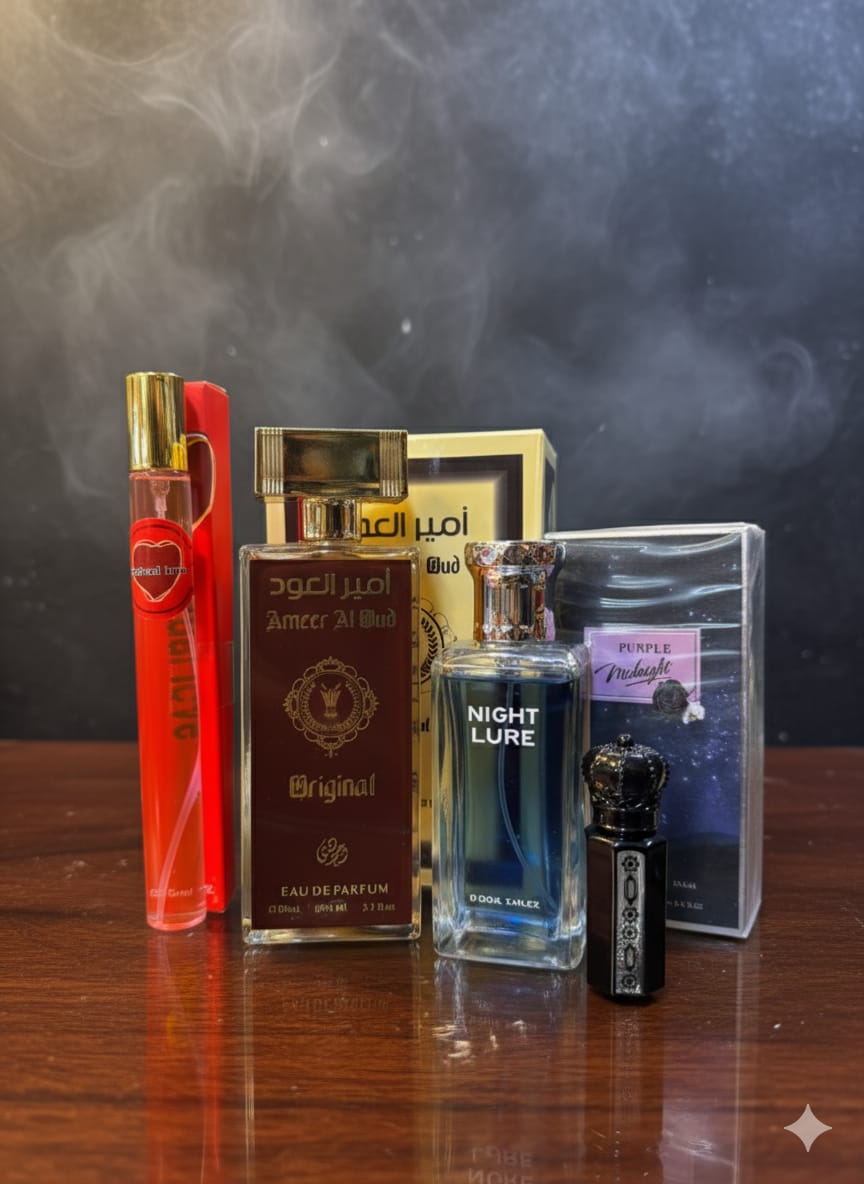 Collection of perfume bottles on a wooden surface with a dark background