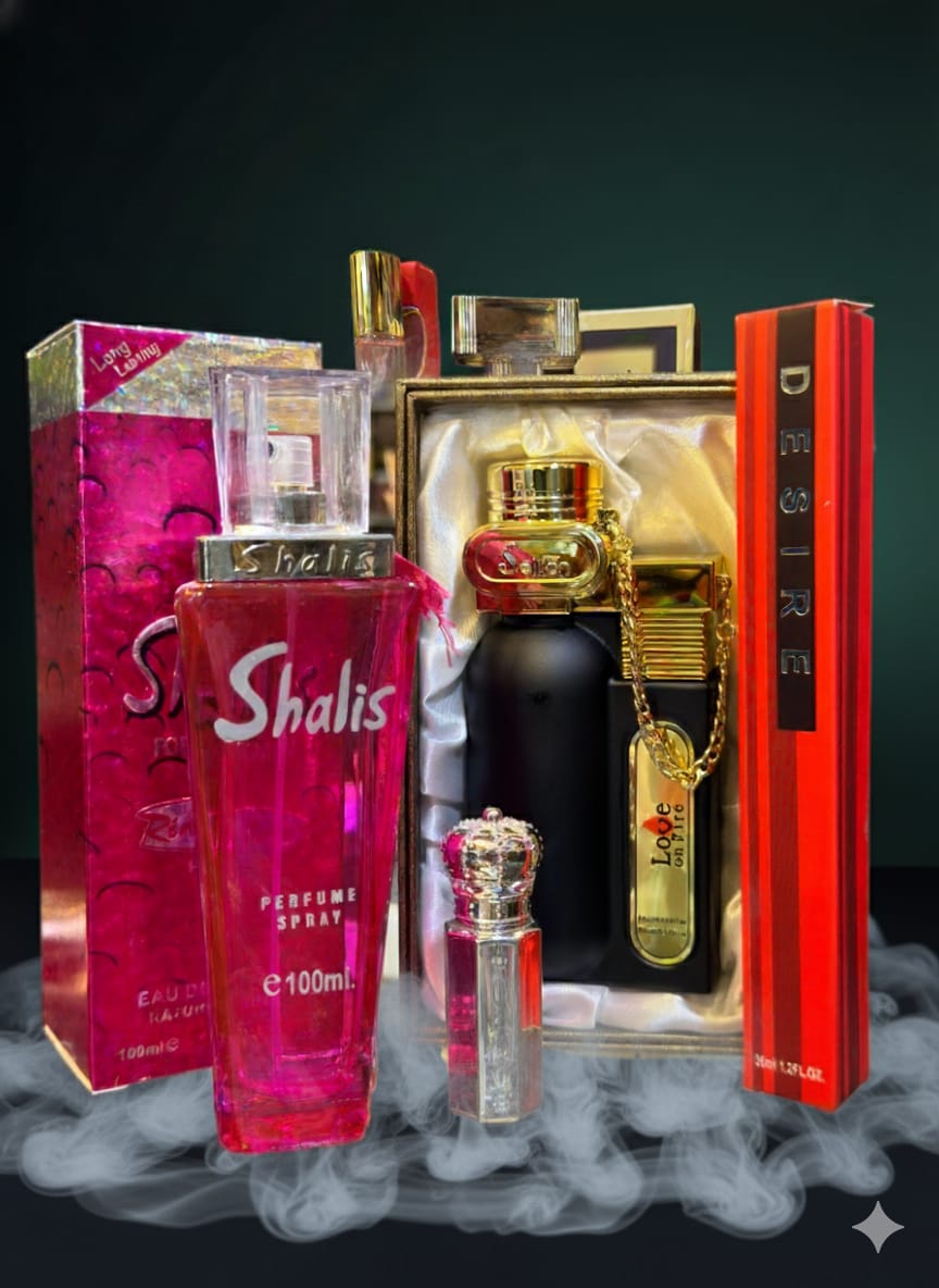 Collection of perfume bottles and packaging on a dark background